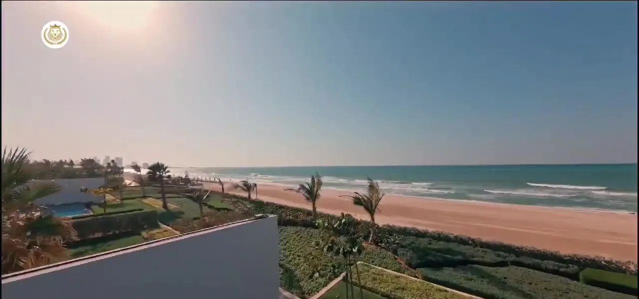 Seaside pool with loungers at the Al Zorah beachfront